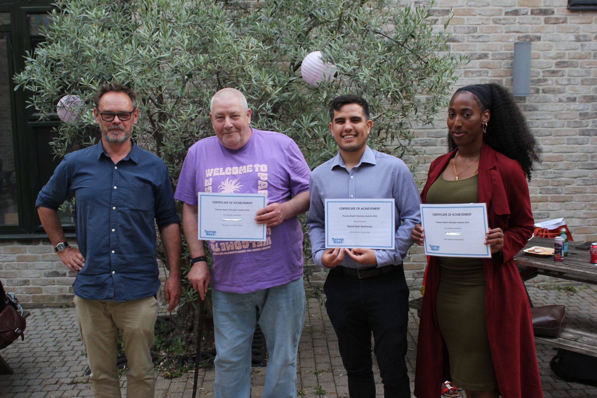 Star volunteers presented with awards at Thames Reach summer event